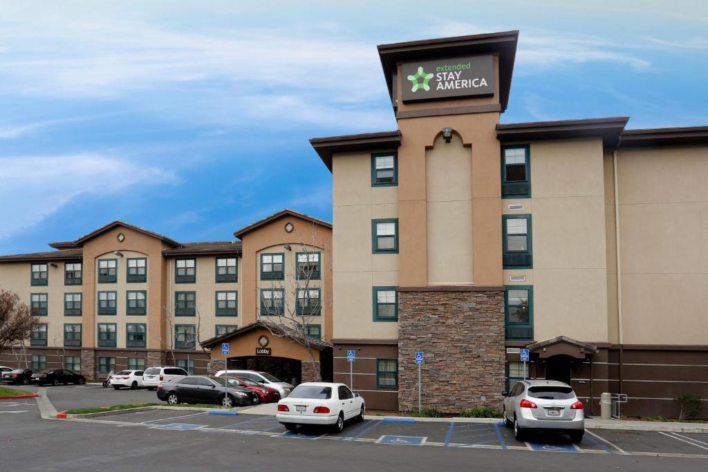 
a large building with a clock on the front of it at Extended Stay America Suites - Los Angeles - Northridge in Northridge
