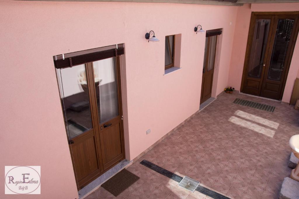Postel nebo postele na pokoji v ubytování ReginElena B&B
