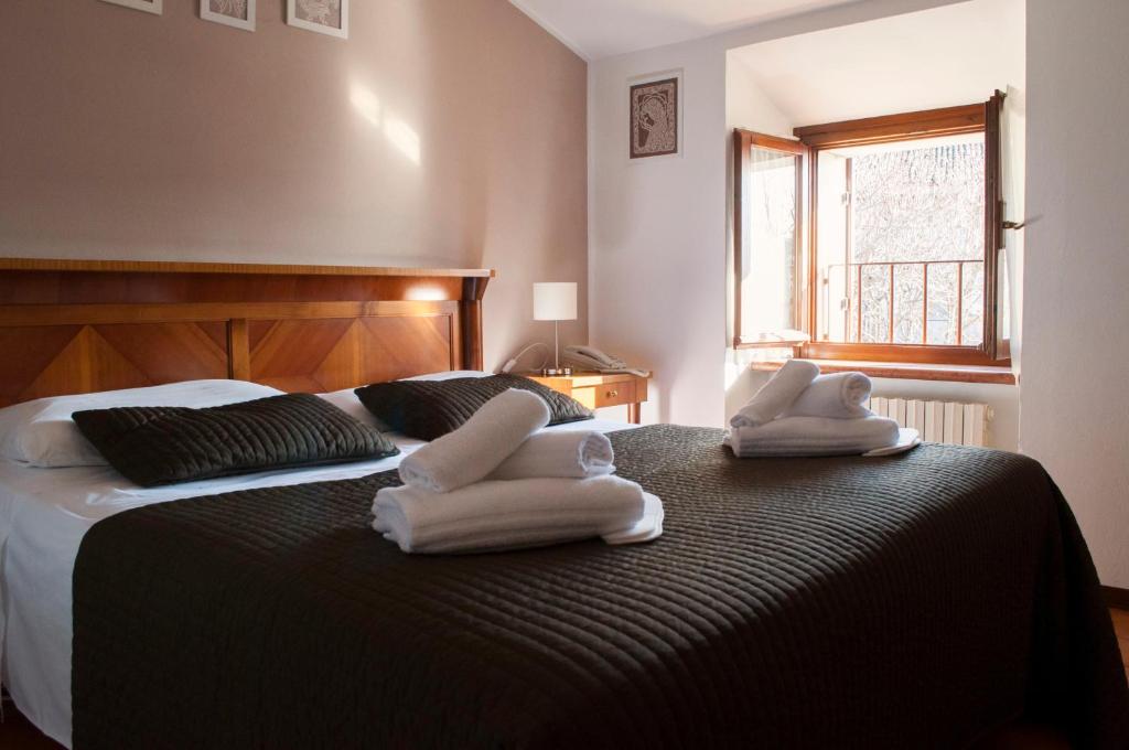 Postel nebo postele na pokoji v ubytování Boutique Hotel Corte Malaspina