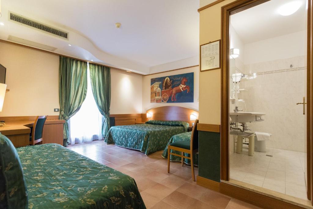 Postel nebo postele na pokoji v ubytování Hotel La Terrazza RESTAURANT & SPA