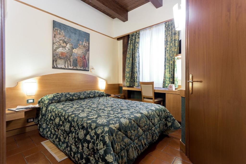 Postel nebo postele na pokoji v ubytování Hotel La Terrazza RESTAURANT & SPA