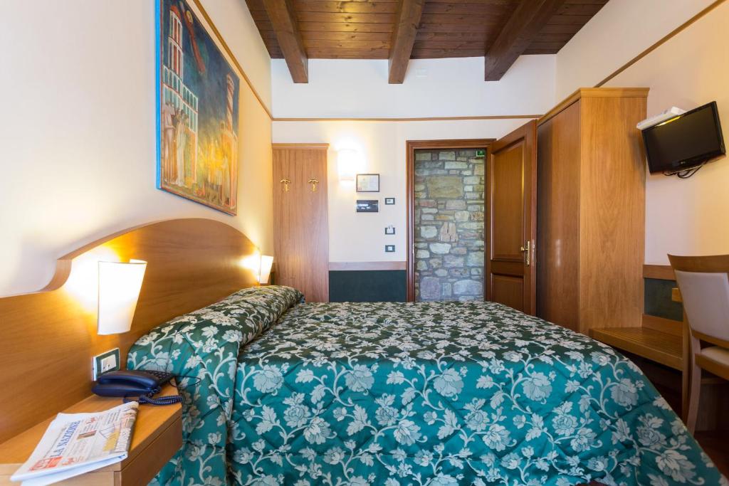 Postel nebo postele na pokoji v ubytování Hotel La Terrazza RESTAURANT & SPA