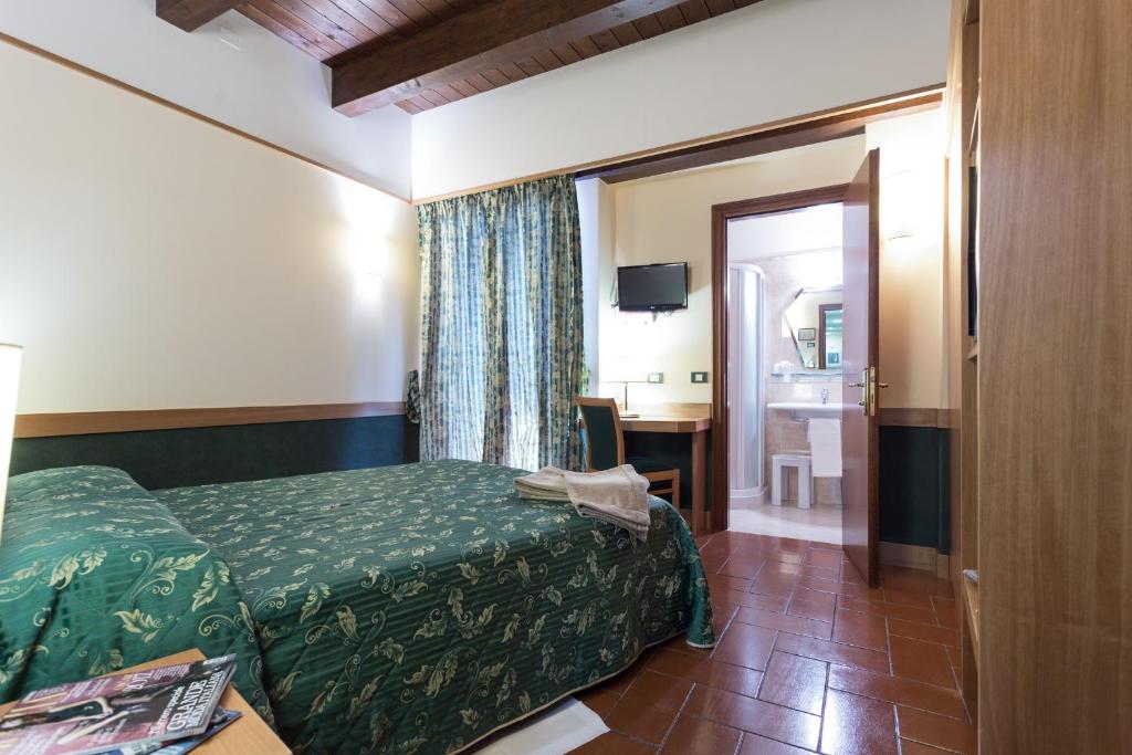 Postel nebo postele na pokoji v ubytování Hotel La Terrazza RESTAURANT & SPA