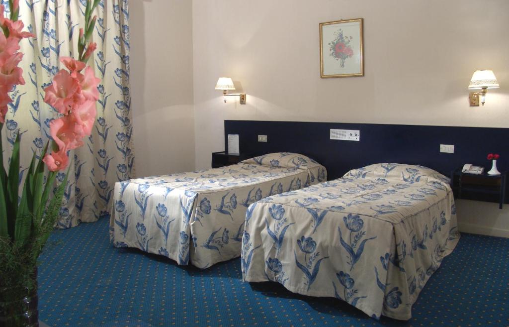 Postel nebo postele na pokoji v ubytování Hotel Concorde Dokki