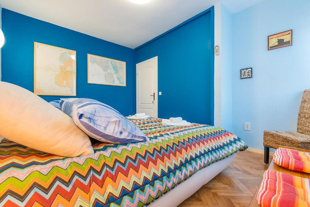 Posteľ alebo postele v izbe v ubytovaní Apartment Alpha and Studio Simba