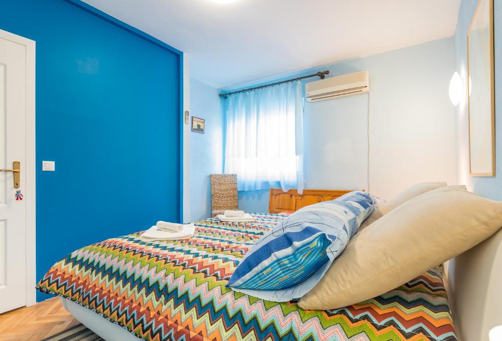 Posteľ alebo postele v izbe v ubytovaní Apartment Alpha and Studio Simba
