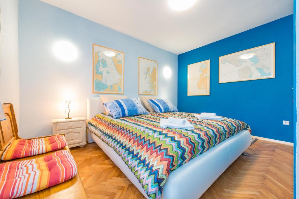 Posteľ alebo postele v izbe v ubytovaní Apartment Alpha and Studio Simba