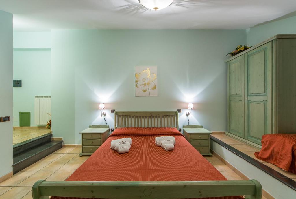 Postel nebo postele na pokoji v ubytování Il Raduno