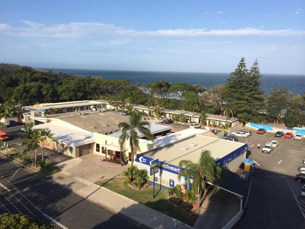 an aerial view of a parking lot in front of a building at Park Beach Hotel Motel in Coffs Harbour