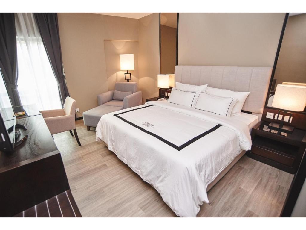 Postel nebo postele na pokoji v ubytování Corsica Hotel