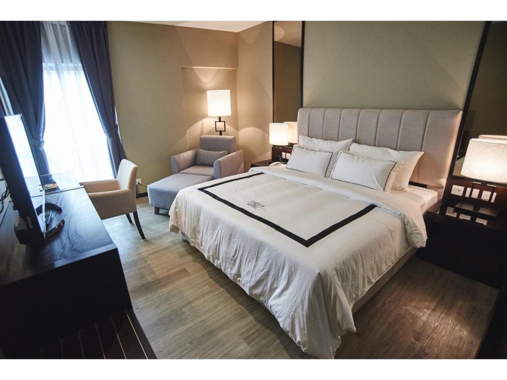 Postel nebo postele na pokoji v ubytování Corsica Hotel
