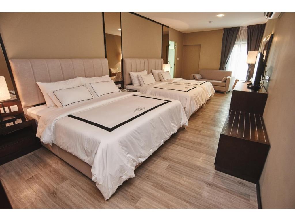 Postel nebo postele na pokoji v ubytování Corsica Hotel