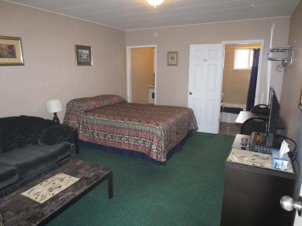 Postel nebo postele na pokoji v ubytování Overlander Motel