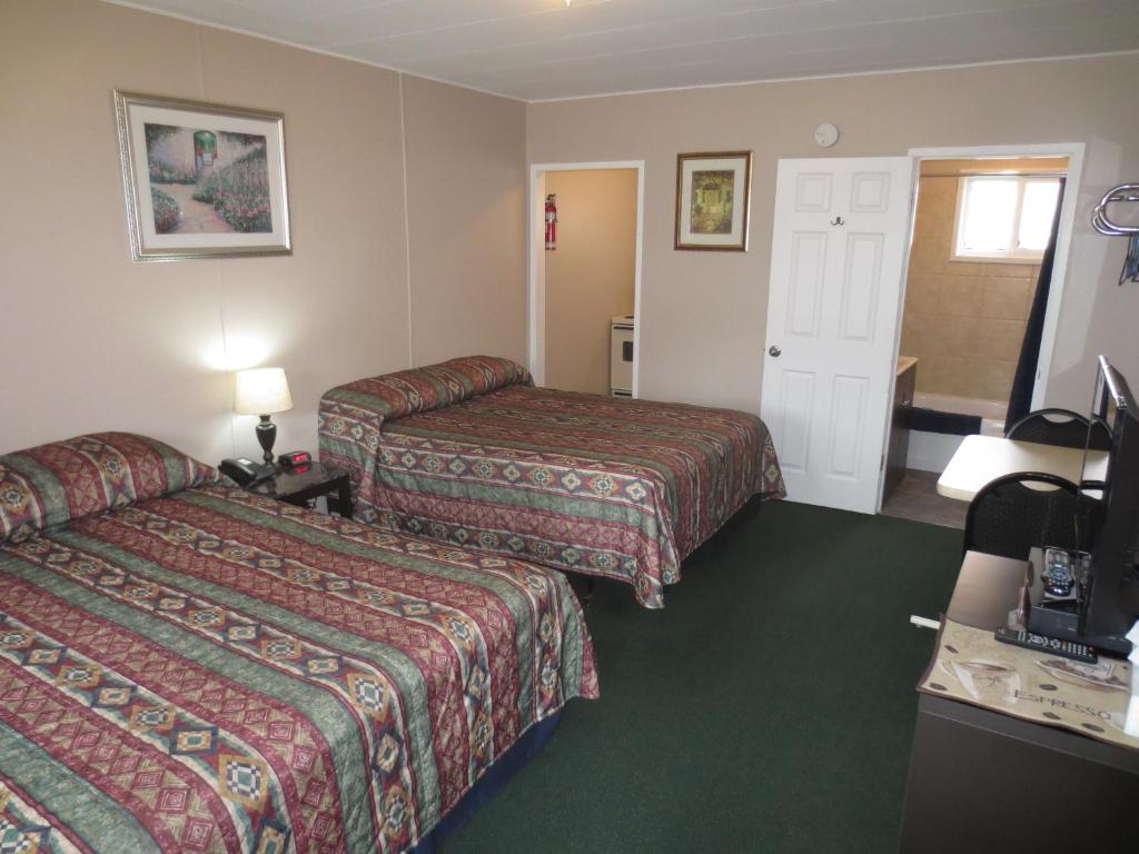 Postel nebo postele na pokoji v ubytování Overlander Motel
