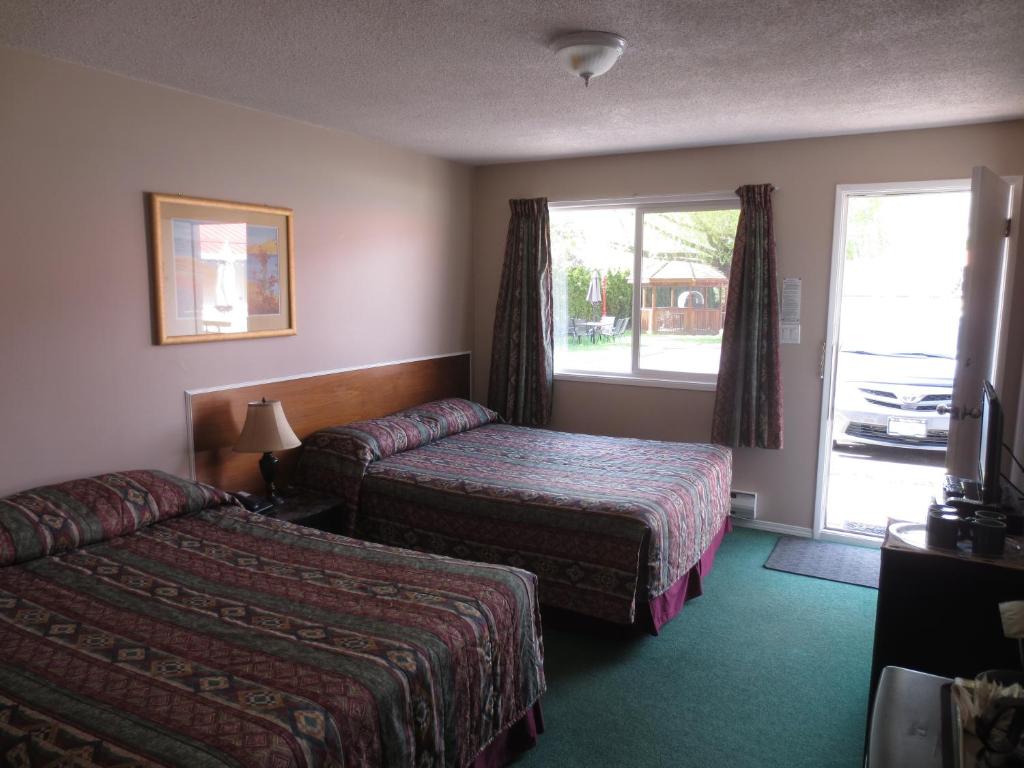 Postel nebo postele na pokoji v ubytování Overlander Motel