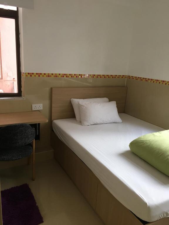 Postel nebo postele na pokoji v ubytování Timehouse Hong Kong Hostel Group