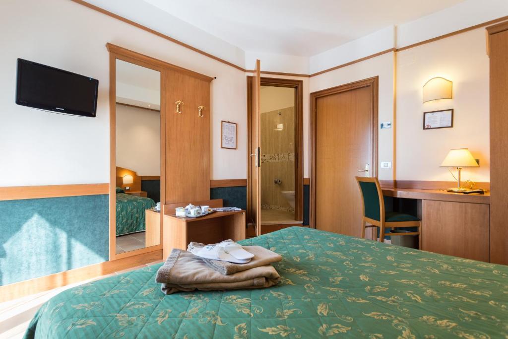 Postel nebo postele na pokoji v ubytování Hotel La Terrazza RESTAURANT & SPA