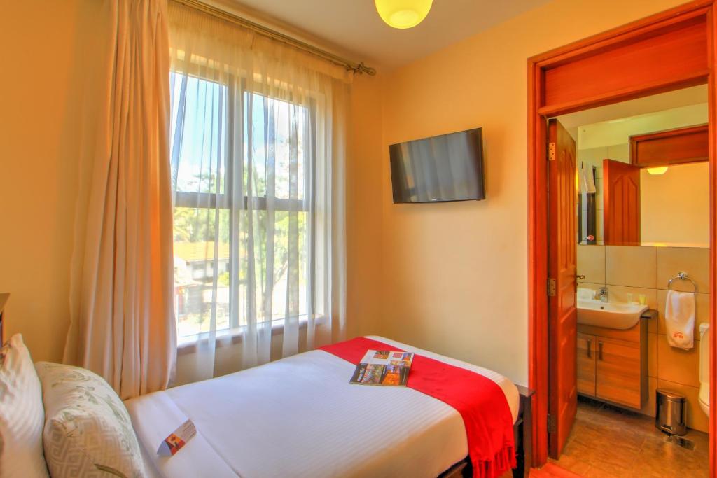 Postel nebo postele na pokoji v ubytování Fedha Residences by Trianum