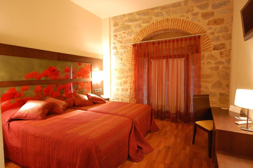 Postel nebo postele na pokoji v ubytování Hotel Los Usías
