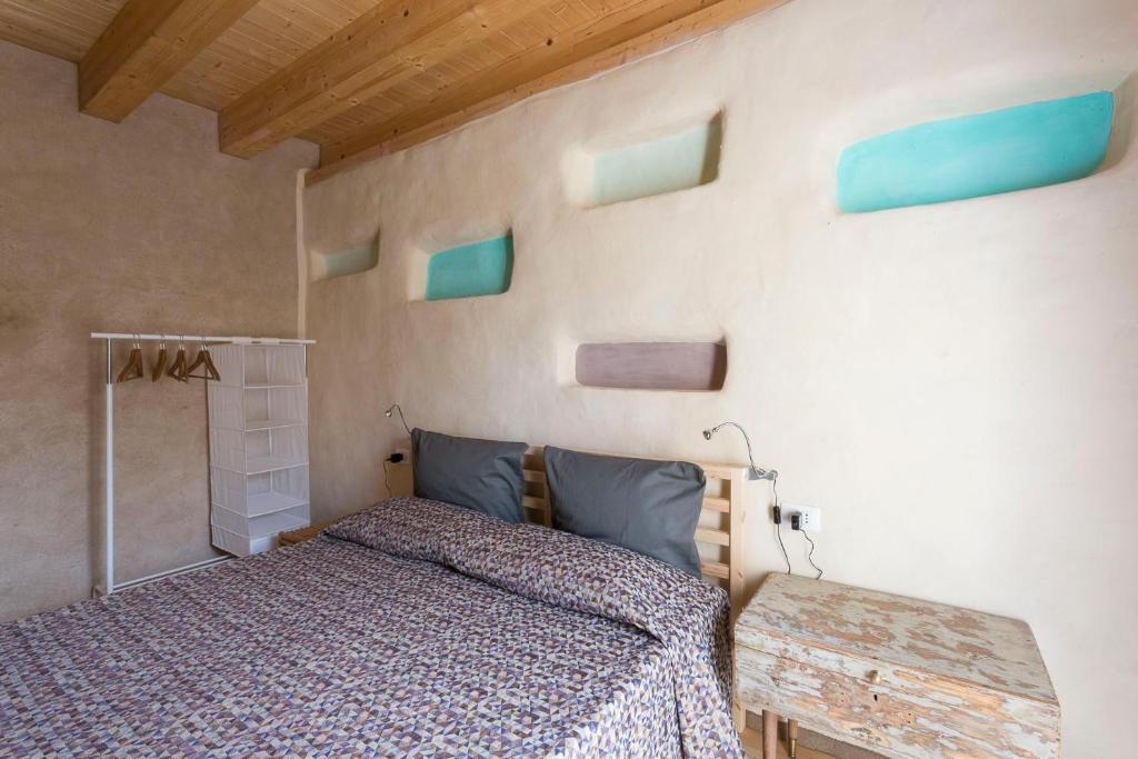 A bed or beds in a room at Sempreverde Atelier B&B
