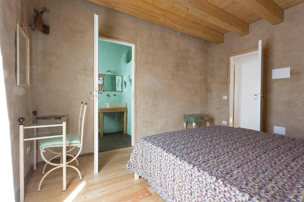 A bed or beds in a room at Sempreverde Atelier B&B