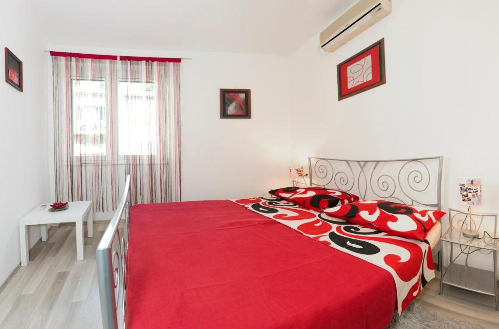 Giường trong phòng chung tại Apartments Sevilja