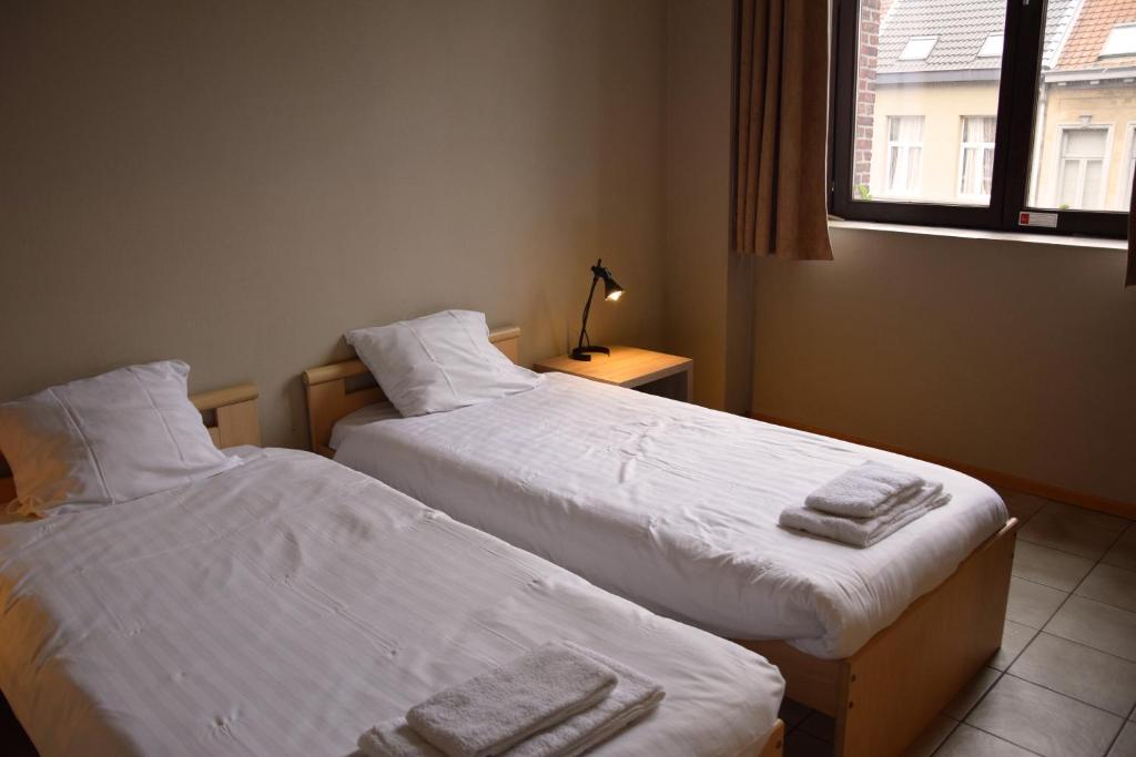 Postel nebo postele na pokoji v ubytování Condo Gardens Antwerp