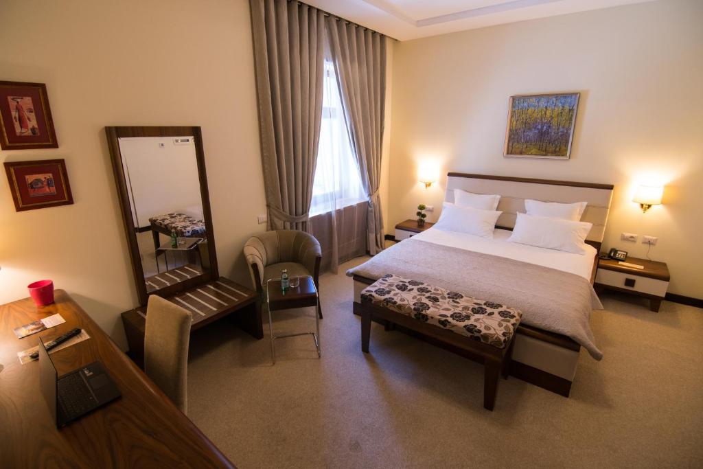 Postel nebo postele na pokoji v ubytování Boutique Hotel Kotoni