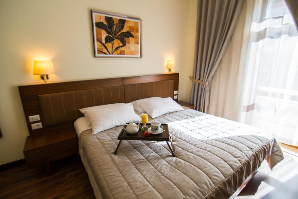 Postel nebo postele na pokoji v ubytování Boutique Hotel Kotoni