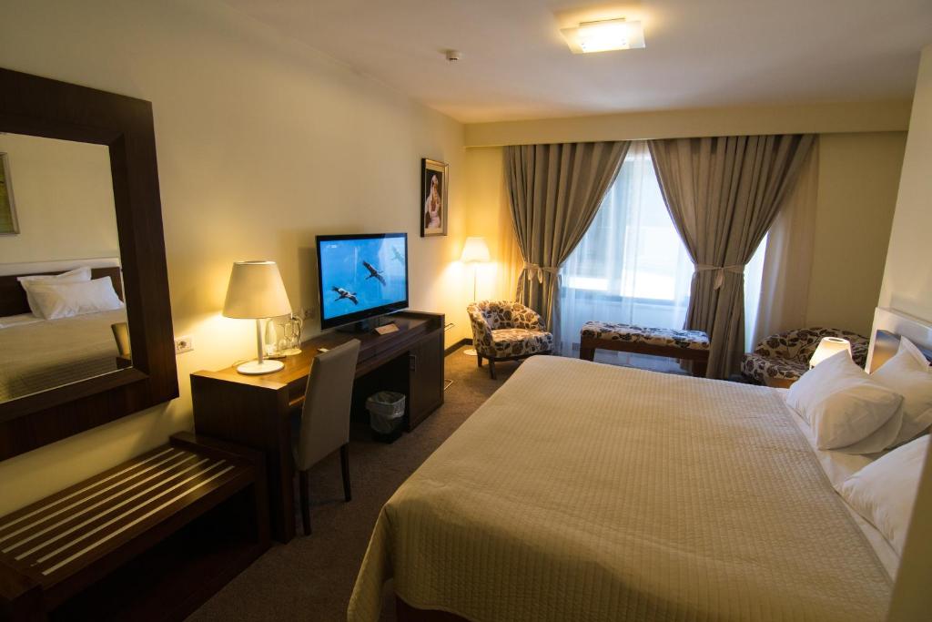 Postel nebo postele na pokoji v ubytování Boutique Hotel Kotoni