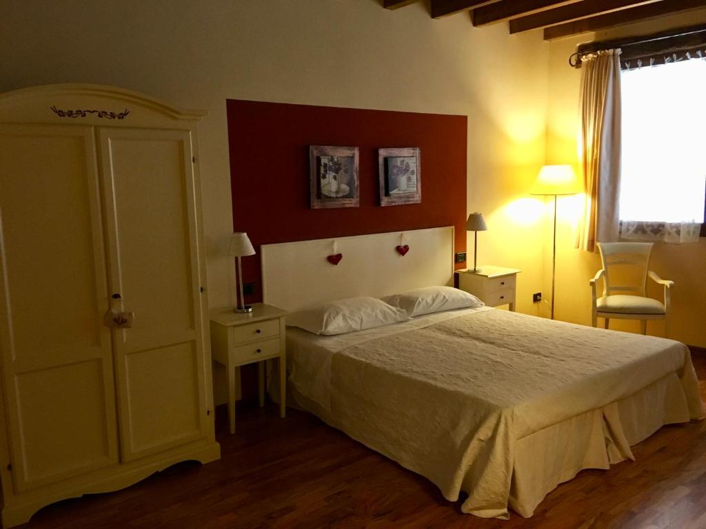 Postel nebo postele na pokoji v ubytování Agriturismo Corte Rocca