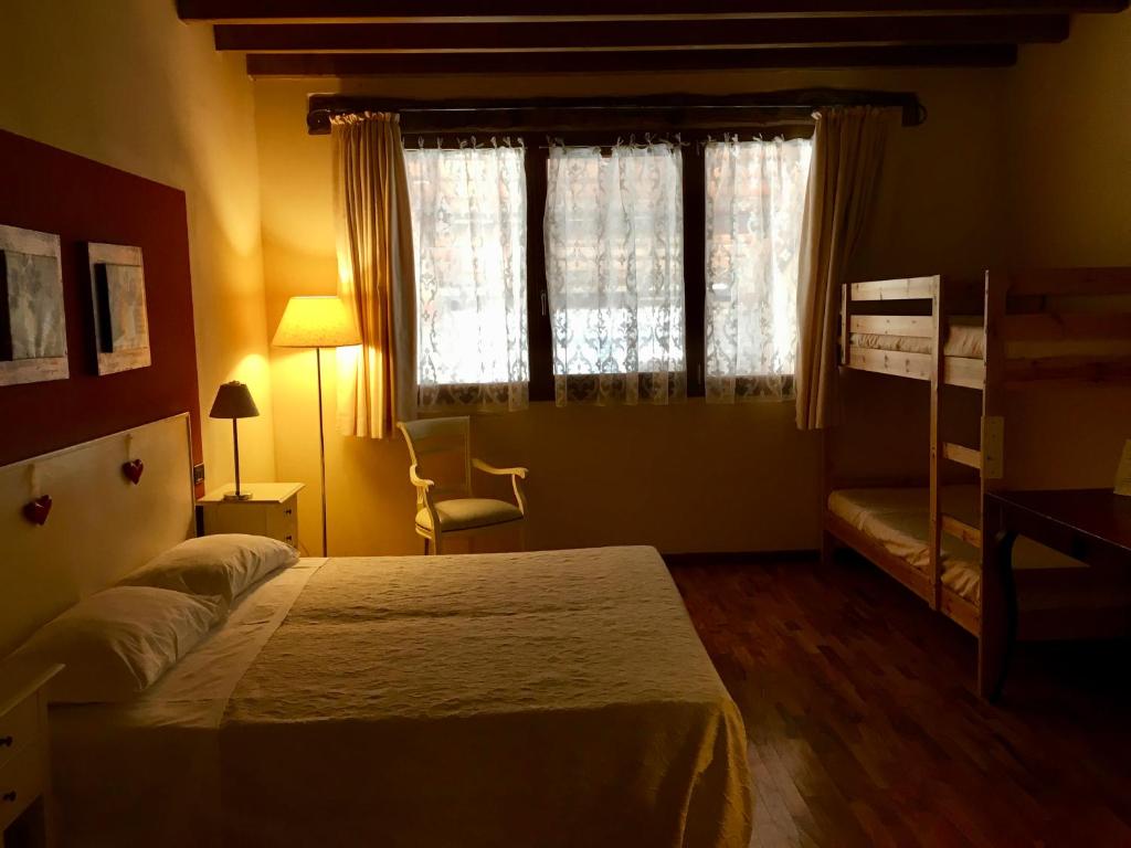 Postel nebo postele na pokoji v ubytování Agriturismo Corte Rocca