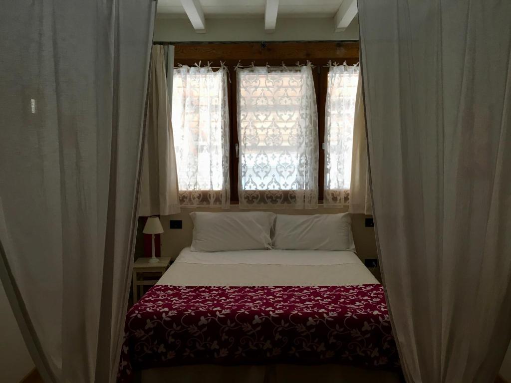 Postel nebo postele na pokoji v ubytování Agriturismo Corte Rocca