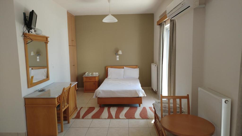 Postel nebo postele na pokoji v ubytování Hotel Lykeon