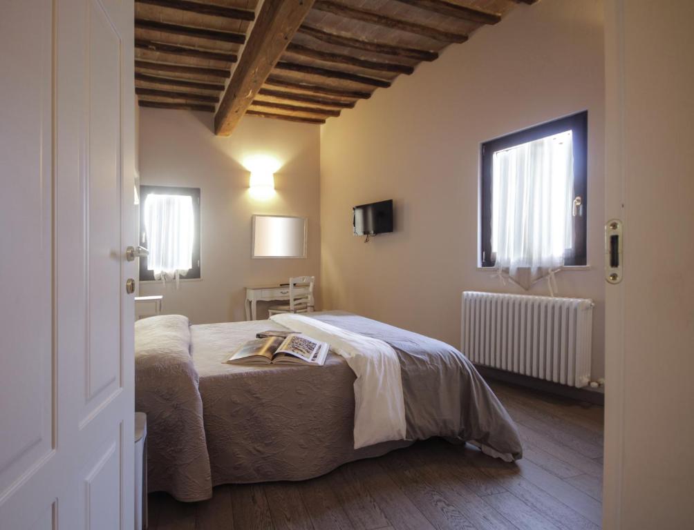 Posteľ alebo postele v izbe v ubytovaní B&B Il Senesino