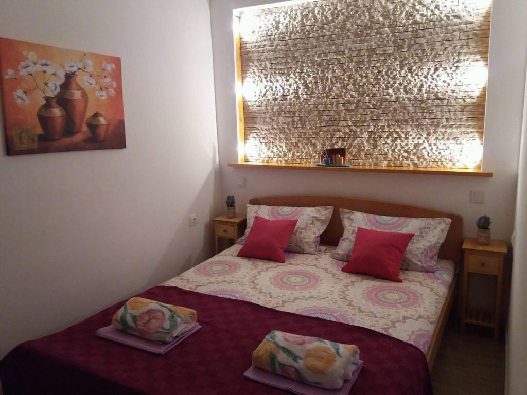 Postel nebo postele na pokoji v ubytování Apartments Marino