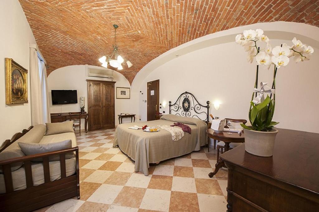 Posteľ alebo postele v izbe v ubytovaní Albergo La Corte Albertina