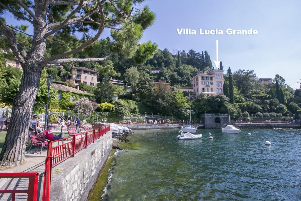 a body of water with boats in it at Villa Lucia Grande Varenna in Varenna