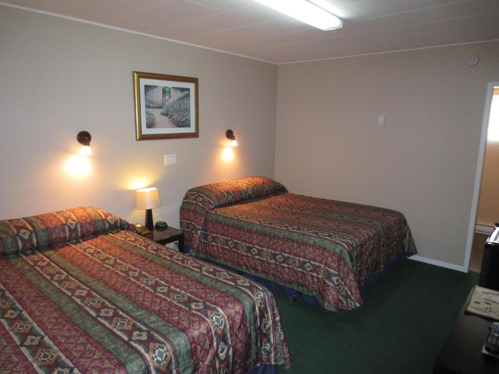 Postel nebo postele na pokoji v ubytování Overlander Motel