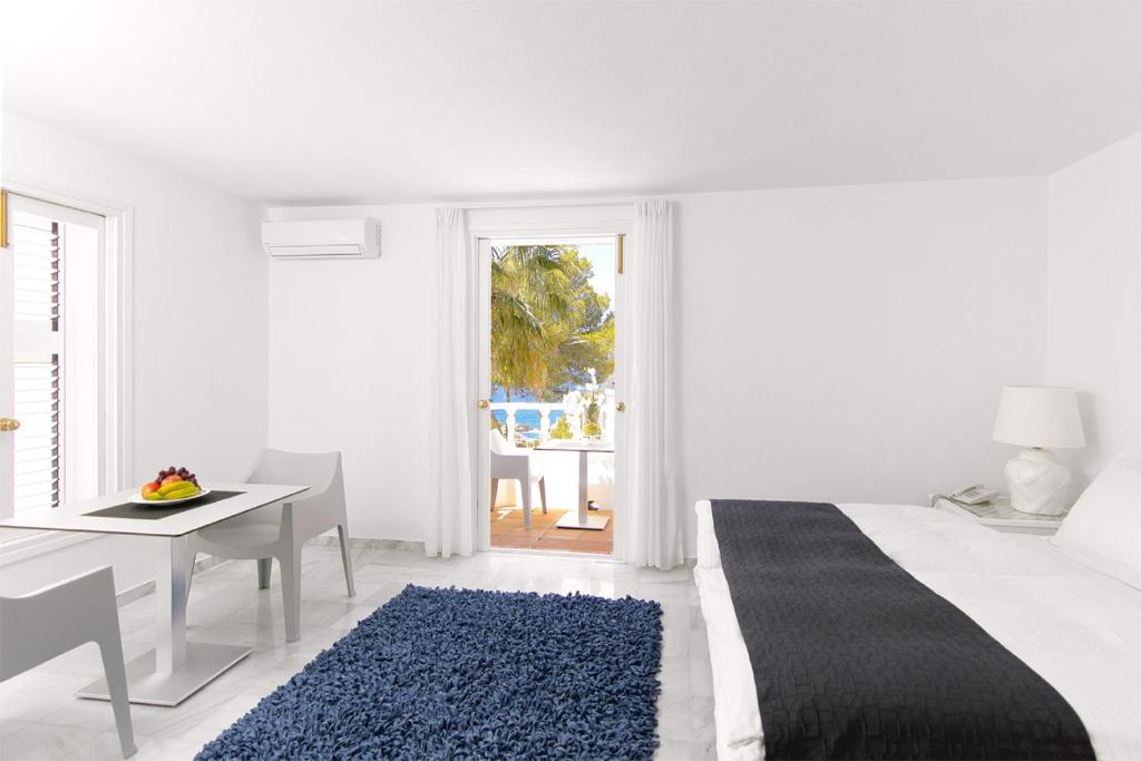 Postel nebo postele na pokoji v ubytování Hotel Village