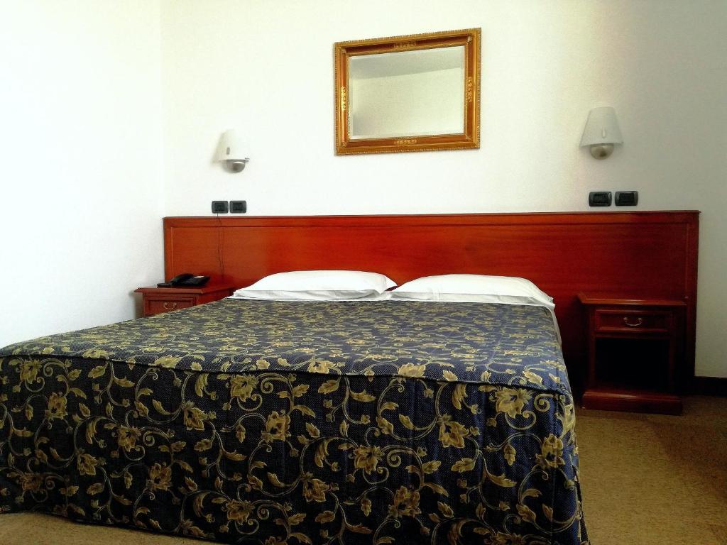 Postel nebo postele na pokoji v ubytování Hotel Medea