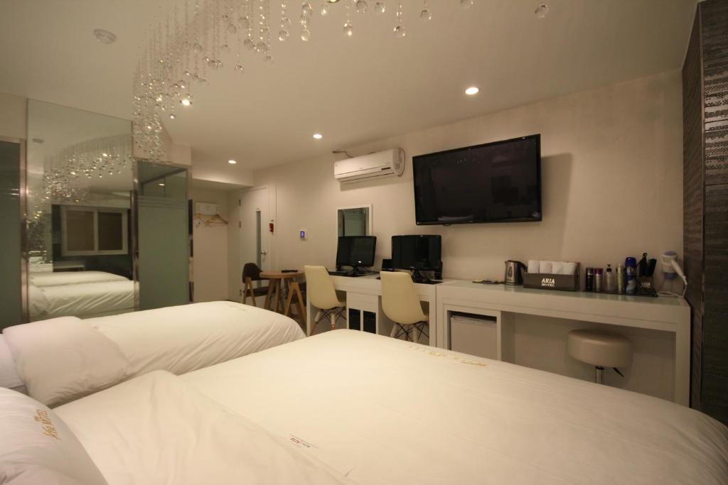 Postel nebo postele na pokoji v ubytování Boutique Hotel Aria Nampo