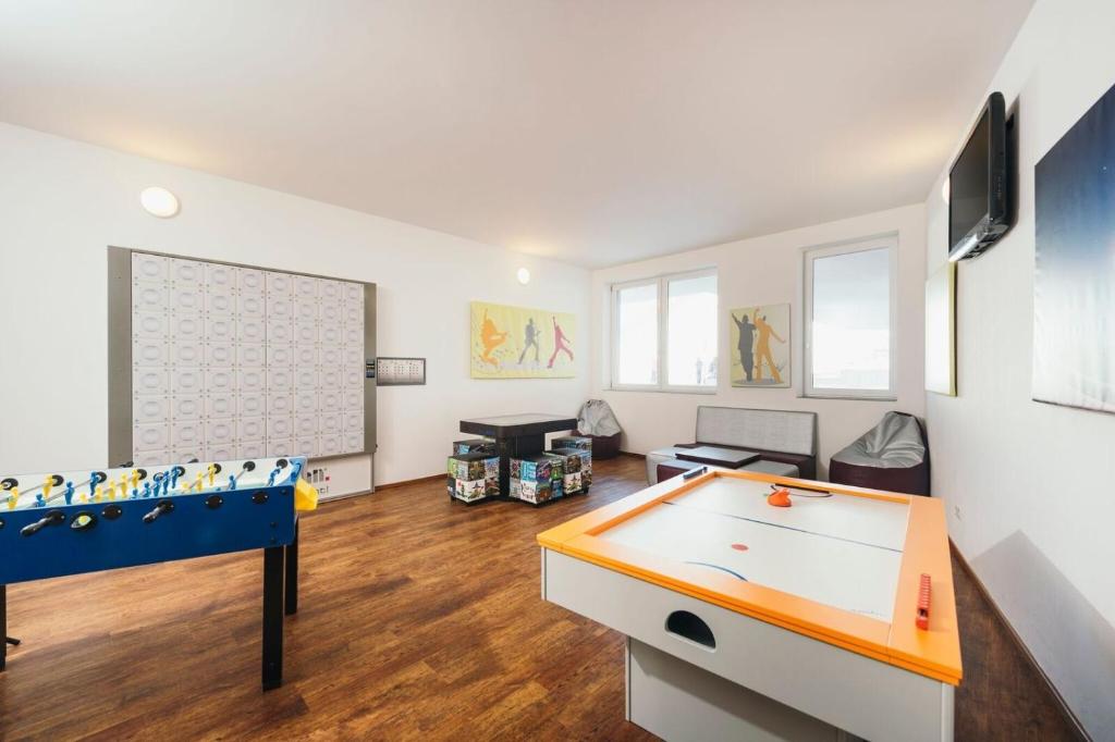 TV a/nebo společenská místnost v ubytování Hotel Alpenrose aktiv & sport