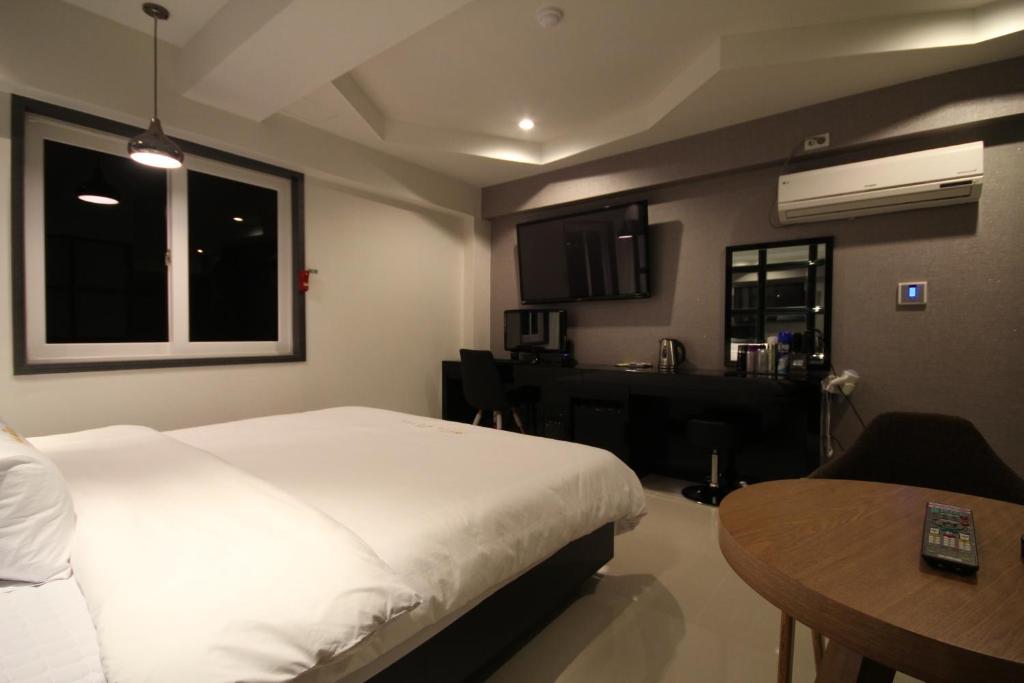 Postel nebo postele na pokoji v ubytování Boutique Hotel Aria Nampo