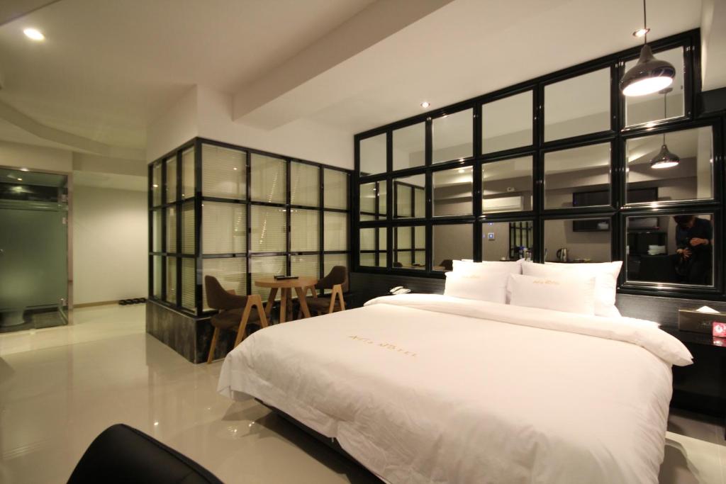 Postel nebo postele na pokoji v ubytování Boutique Hotel Aria Nampo