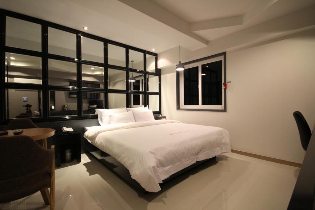Postel nebo postele na pokoji v ubytování Boutique Hotel Aria Nampo