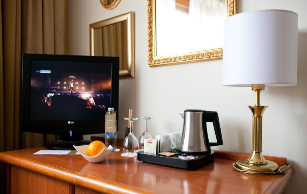 TV a/nebo společenská místnost v ubytování Hotel Globo