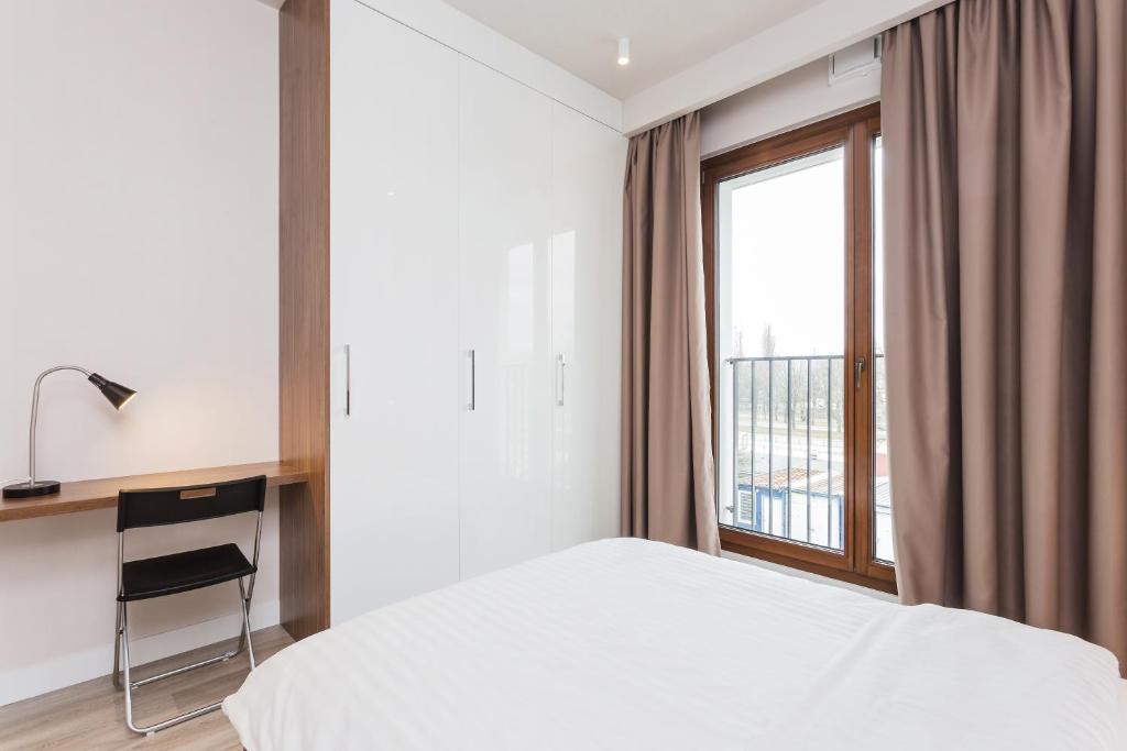Posteľ alebo postele v izbe v ubytovaní Platinum Residence Mokotów