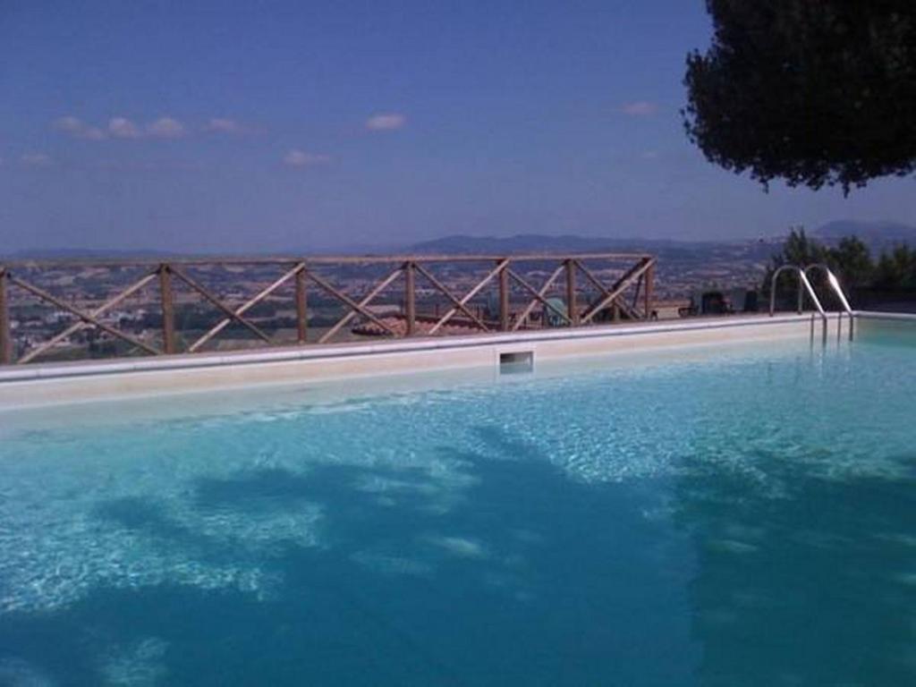 The swimming pool at or close to Il Poggio Delle Ginestre