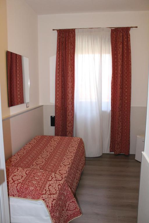 Postel nebo postele na pokoji v ubytování Alla Bianca Hotel